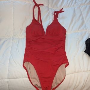 Red one piece cinched waist bathing suit